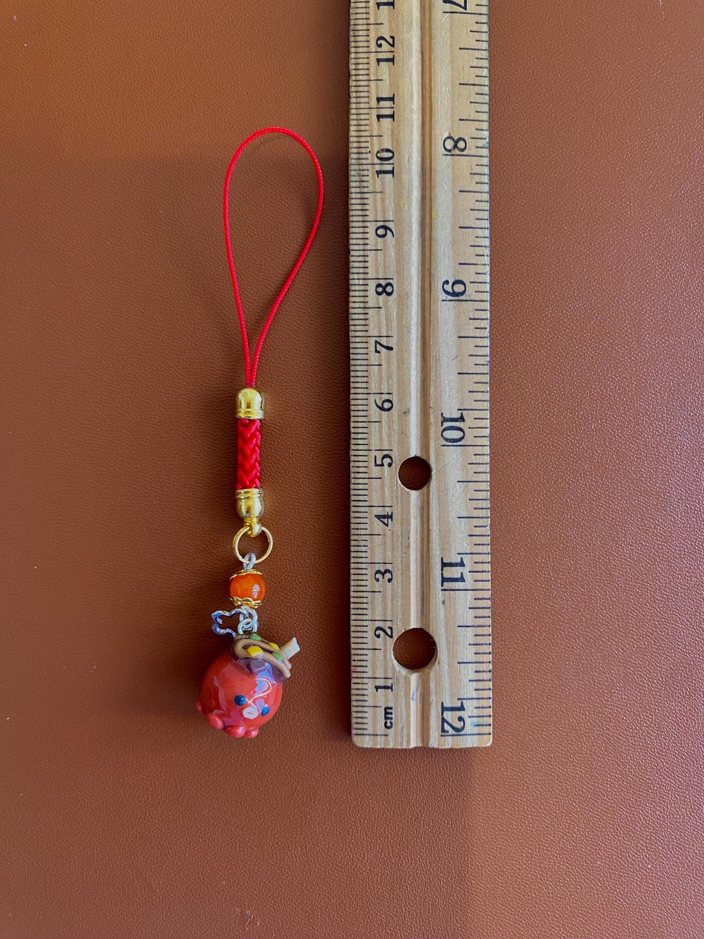 Wapo the Takoyaki, a clay keychain